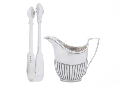 Lot 19 - An Edwardian silver cream jug, and a pair of George IV sugar tongs.