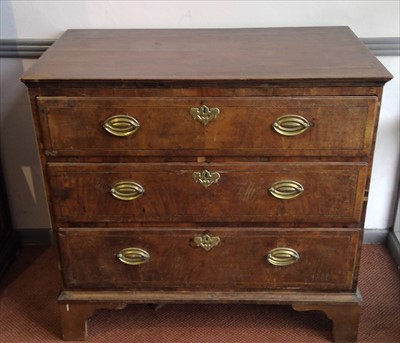 Lot 3470 - A George II walnut chest of drawers, with...