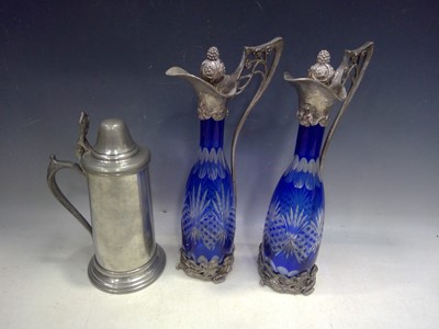 Lot 13 - A pair of blue overlay cut glass claret jugs,...