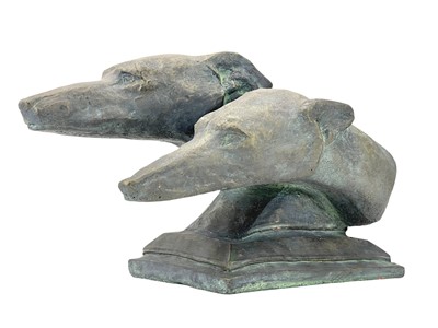 Lot 379 - A pair of reconstituted stone greyhound heads.