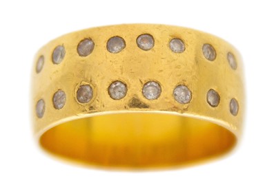 Lot 187 - A 22k hallmarked gold diamond set band ring.