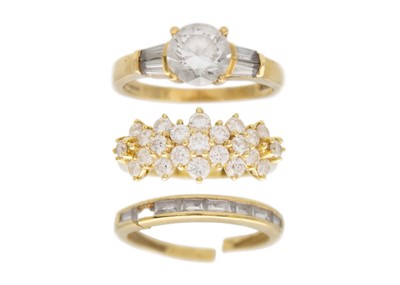 Lot 197 - A selection of three 14k gold CZ set dress rings.