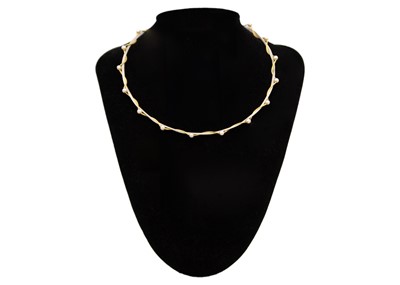 Lot 198 - A modern 18k yellow and white gold wire pearl applied 16" necklace.