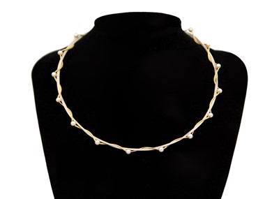 Lot 198 - A modern 18k yellow and white gold wire pearl applied 16" necklace.