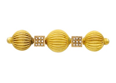 Lot 204 - A Victorian high purity gold (tests 14k) seed pearl set triple fluted ball design brooch.