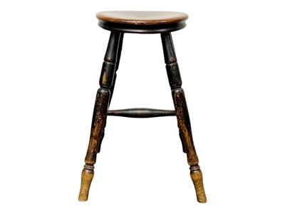 Lot 352 - A Victorian fruitwood and elm circular stool.