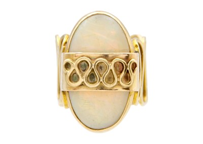 Lot 206 - An opal dress ring in 14k yellow gold.