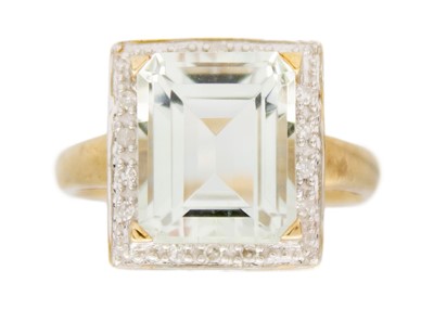 Lot 208 - A rock crystal quartz and diamond ring in 9k yellow gold.