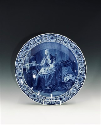 Lot 902 - A 20th century Delft charger, painted with a...