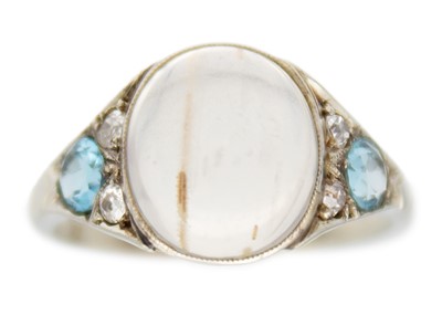 Lot 217 - A moonstone, topaz, and diamond 18k white gold art-deco ring.