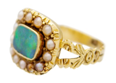 Lot 104 - An early 19th-century mourning ring with an opal replacement.