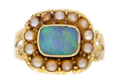 Lot 104 - An early 19th-century mourning ring with an opal replacement.