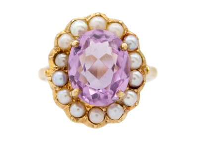 Lot 232 - An amethyst and split seed pearl 9k gold dress ring.