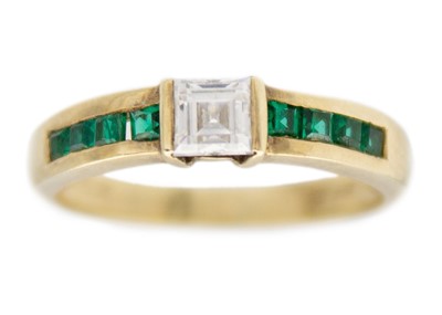 Lot 233 - A 9k yellow gold CZ ring.