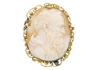 Lot 235 - A Victorian shell cameo in a yellow metal frame, carved with a profile of Michelangelo.