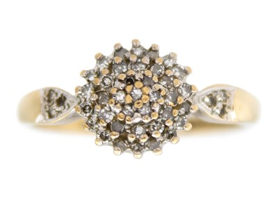 Lot 254 - A 9k gold diamond cluster ring.