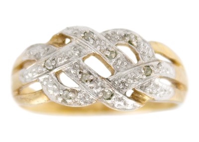 Lot 243 - A 9k yellow gold diamond knot ring.