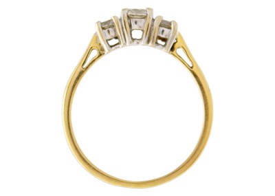 Lot 245 - An 18k yellow gold three-stone diamond ring.