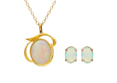 Lot 246 - An Australian precious opal pendant and earring set.