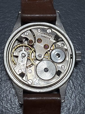 Lot 641 - LONGINES - A WWII era (possibly French Resistance) stainless steel gentleman's wristwatch.