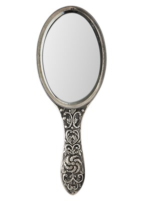Lot 65 - A Victorian silver embossed hand mirror by Charles Stuart Harris.