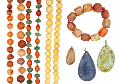 Lot 266 - A collection of carnelian, agate, and bone beads, a bracelet and hard stone pendants.