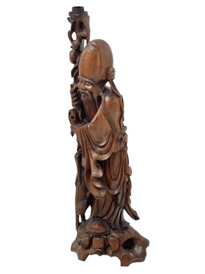 Lot 720 - A large Chinese hardwood figure of Shou Lao.
