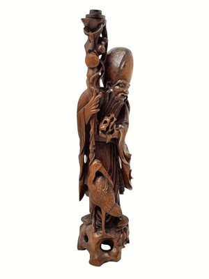 Lot 720 - A large Chinese hardwood figure of Shou Lao.