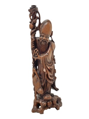 Lot 720 - A large Chinese hardwood figure of Shou Lao.