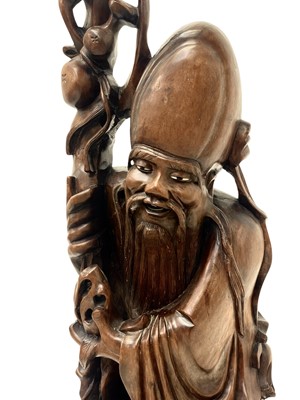 Lot 720 - A large Chinese hardwood figure of Shou Lao.