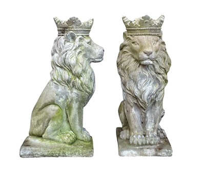 Lot 356 - A pair of reconstituted stone sculptures of seated lions wearing crowns.