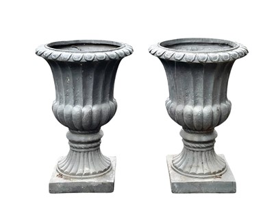 Lot 375 - Two composition garden urns of campana form.