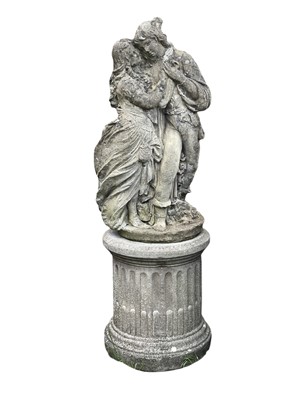 Lot 366 - A reconstituted stone sculpture of a courting couple.