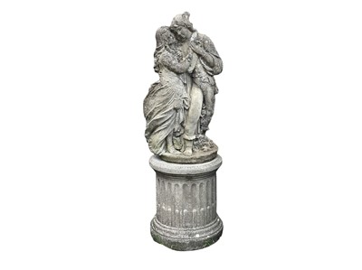 Lot 384 - A reconstituted stone sculpture of a courting couple.
