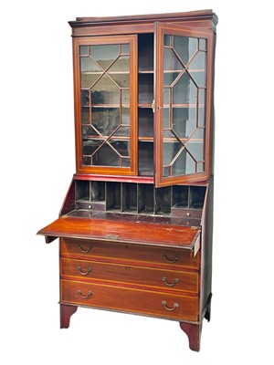 Lot 408 - An Edwardian mahogany and satinwood banded bureau bookcase.