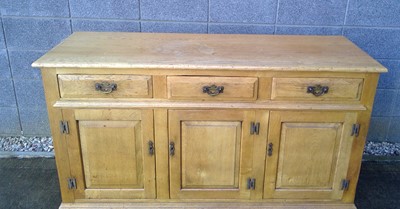 Lot 4 - A Side Board. In Elm, the Sideboard measures...