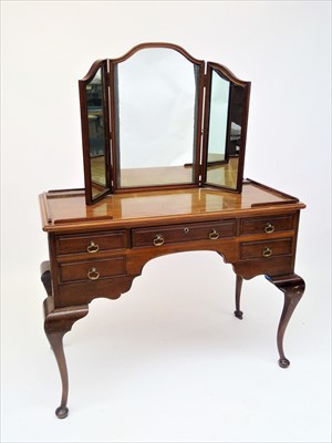 Lot 3514 - A walnut dressing table, with triple mirror...