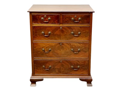 Lot 403 - A mahogany chest of two short and three long drawers.