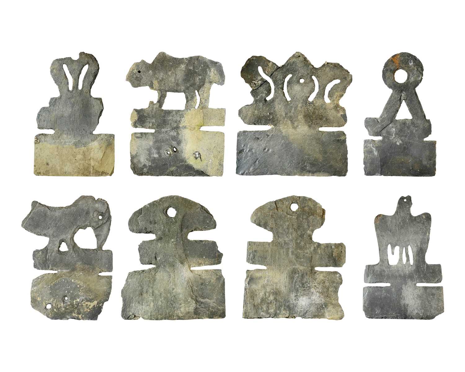 Lot 74 - Nine Breton slate decorative ridge tiles,