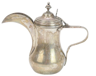 Lot 600 - A small Arabian silver dallah pot.