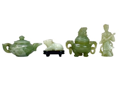 Lot 632 - A Chinese jade miniature koro and cover.