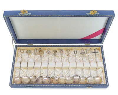 Lot 545 - A set of 12 Chinese novelty silver spoons.