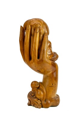 Lot 515 - A carved hardwood figure group.