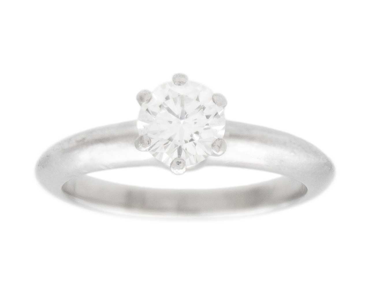 Lot 11 - TIFFANY & CO - A good platinum 0.59ct diamond solitaire ring with certificate and box.