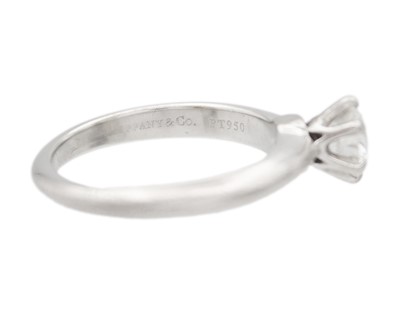 Lot 11 - TIFFANY & CO - A good platinum 0.59ct diamond solitaire ring with certificate and box.