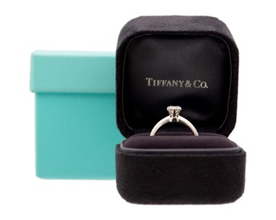 Lot 11 - TIFFANY & CO - A good platinum 0.59ct diamond solitaire ring with certificate and box.