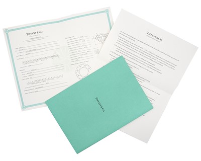 Lot 11 - TIFFANY & CO - A good platinum 0.59ct diamond solitaire ring with certificate and box.