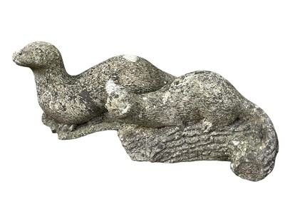 Lot 378 - Two reconstituted stone figures of otters.