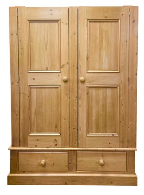 Lot 405 - A pine wardrobe.