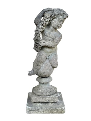 Lot 359 - A reconstituted stone garden sculpture of a putto holding a strand of hops.